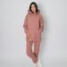 Woman wearing a matching dusty rose hoodie and jogger set, showcasing cute Amazon cozy loungewear perfect for comfortable all-day wear from morning to night.