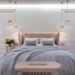 Luxury hotel inspired bedroom featuring a soft upholstered bed, warm pendant lighting, neutral decor, and calming Amazon bedroom finds for a cozy, elegant space